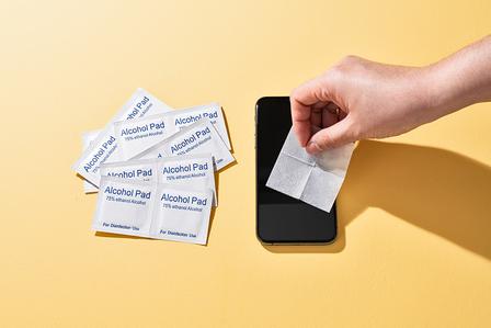 Alcohol prep pad used for smartphone screen cleaning and disinfection